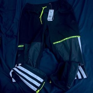 Adidas and it is a medium and neon yellow with black and white